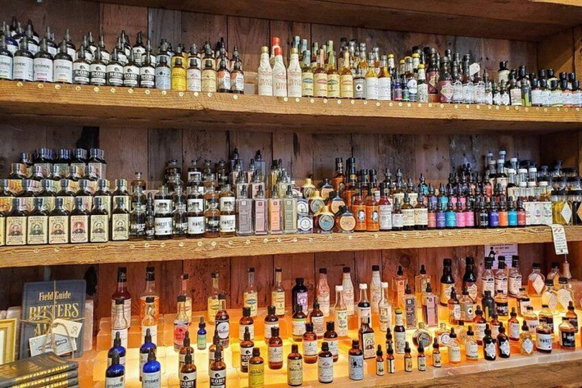 Shelves stocked with various bottles of alcohol, including spirits and liquors. 3
