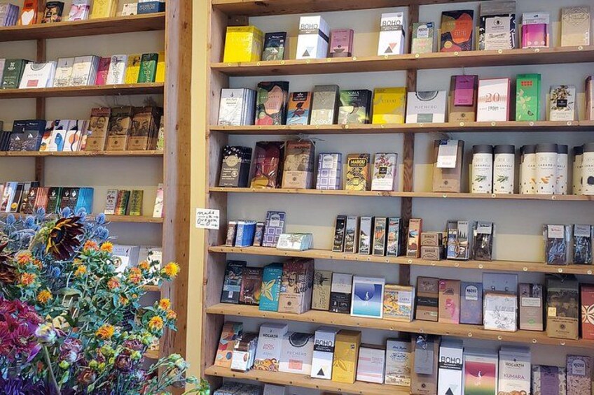 Shelves stocked with various packaged goods, including books and boxes. 2