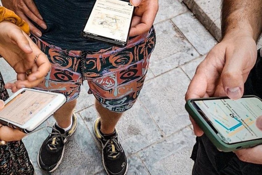 People holding smartphones and a map. 3