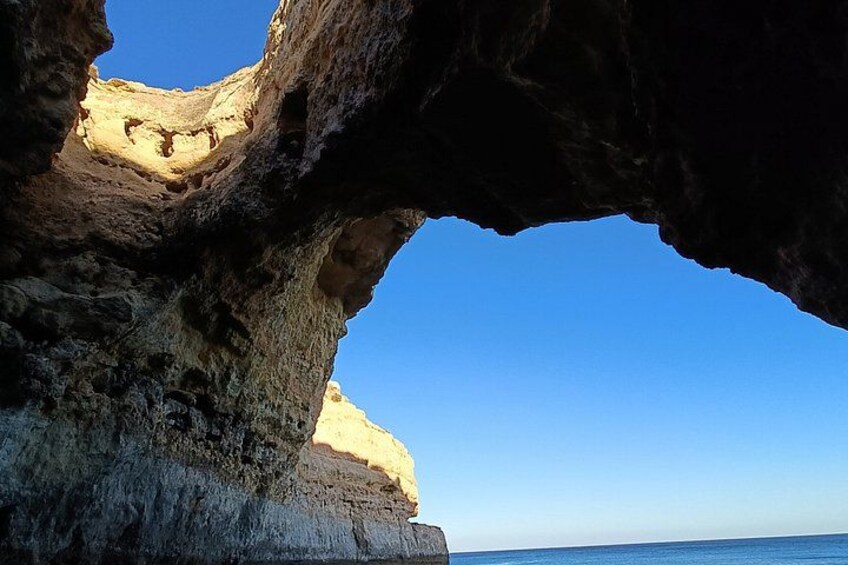 A rock formation with a natural archway. 3