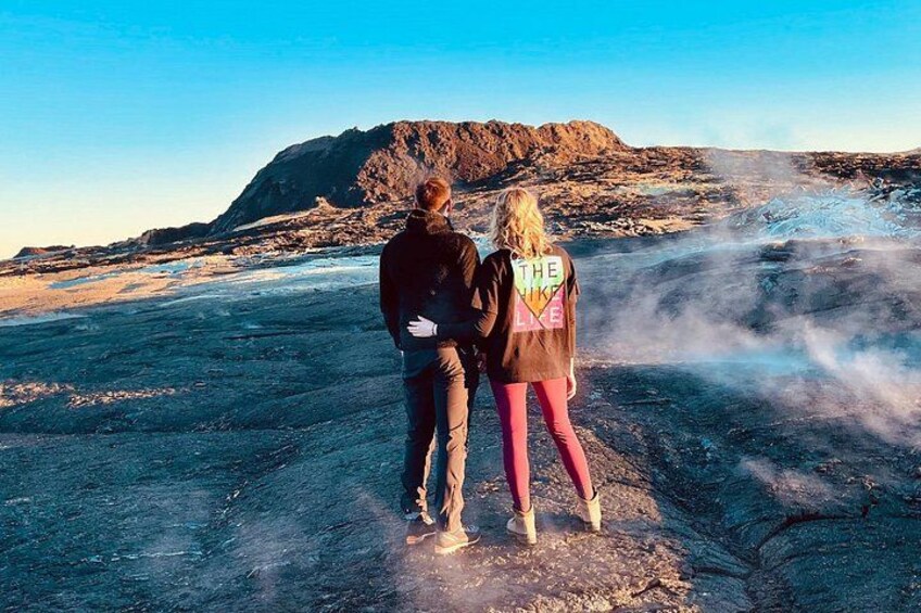Couple overlooking the crater at fagradalsfjall Volcano-safe distance. 4