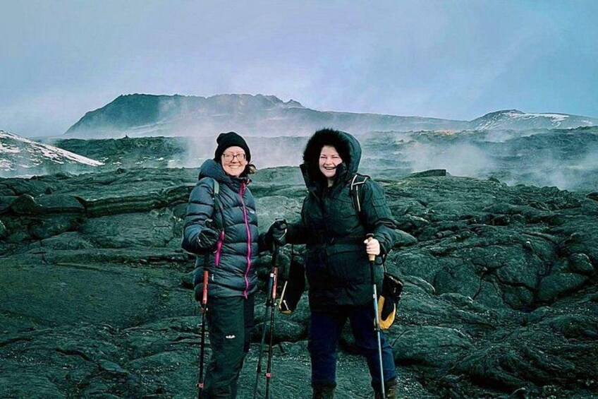 Two ladies having fun with our guide around the lava field 2