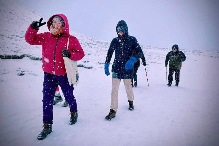 A group walking over the snow to reach Fagradalsfjall volcano in the winter 3