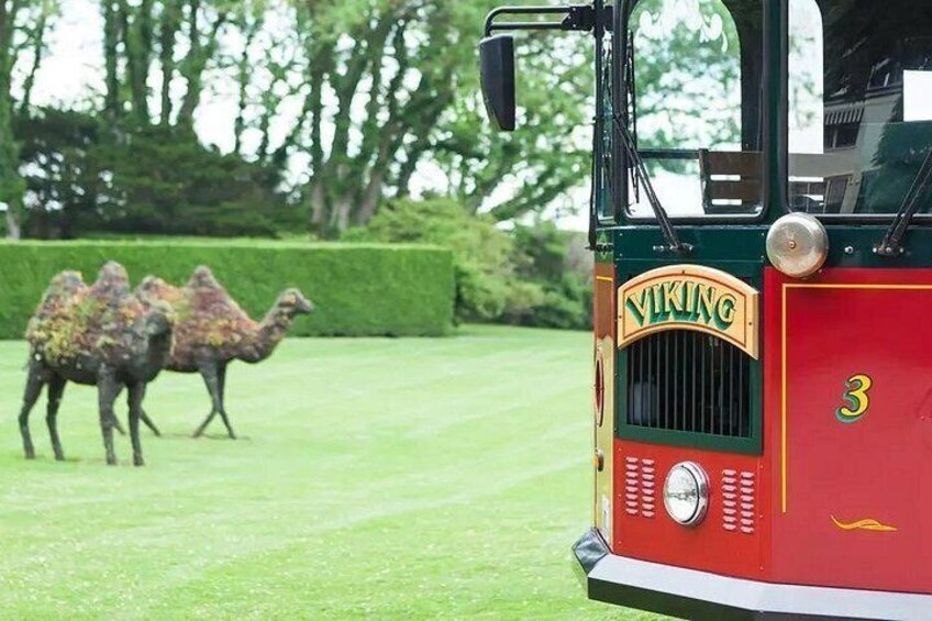 A Viking-themed vehicle with camels in the background. 2