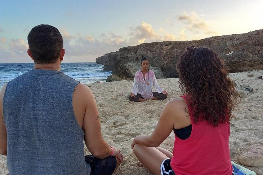 Couple beach meditation Aruba 1