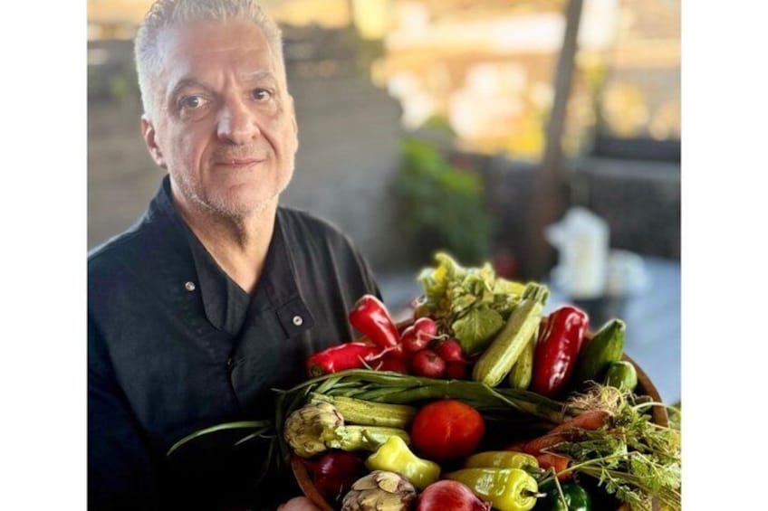A person holding a basket of fresh vegetables. 3