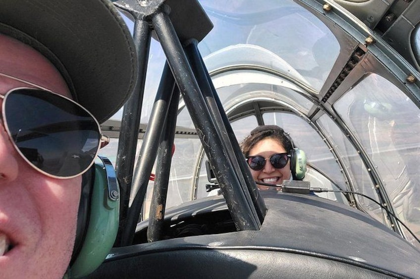 A cockpit interior with a person wearing a headset. 2