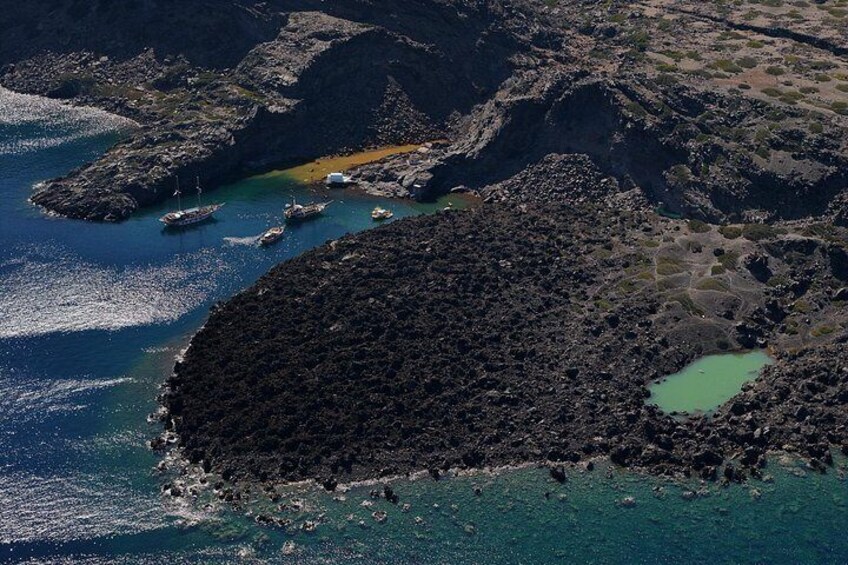 A rugged coastline with rocky outcrops and clear blue waters. 2