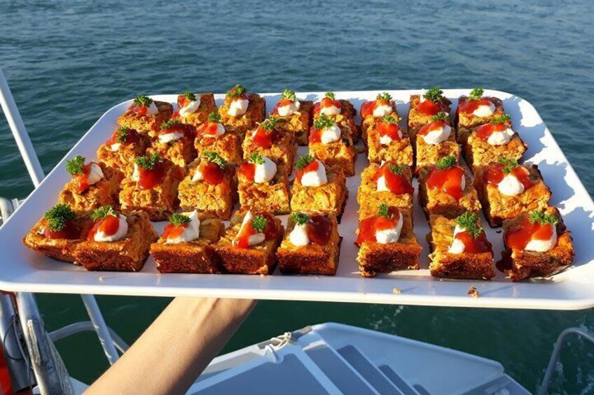 A tray of food on a boat. 5