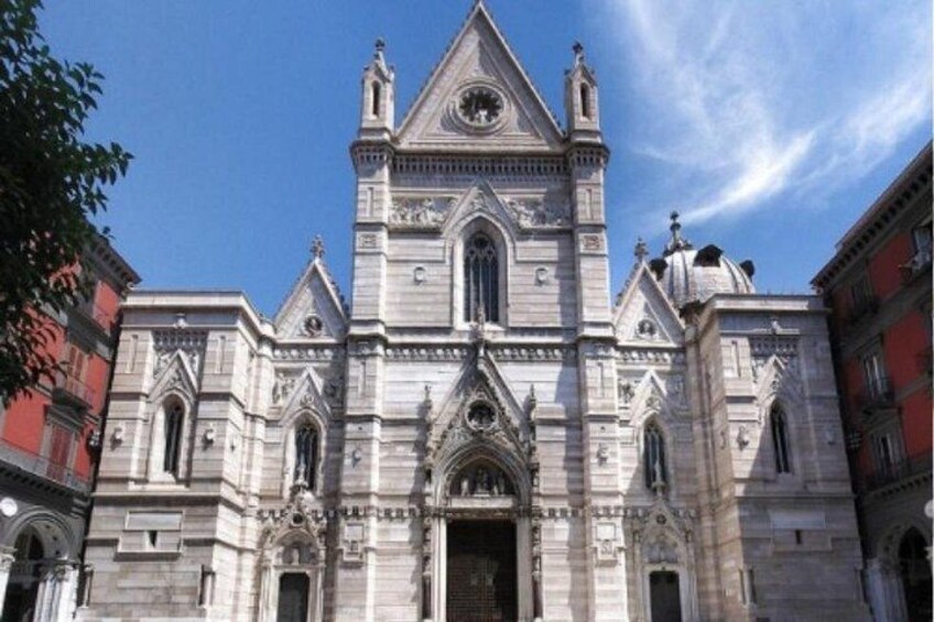 A large, historic church with a prominent bell tower and intricate architectural details. 3
