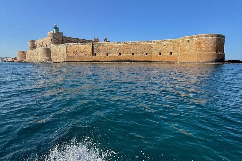 A large stone fortress by the sea. 4
