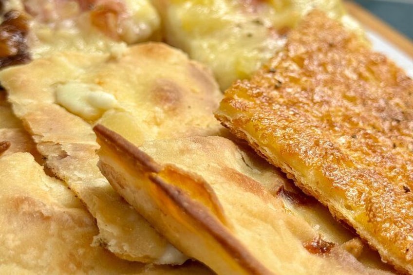 A close-up of a baked dish with golden-brown crust and a creamy filling. 5