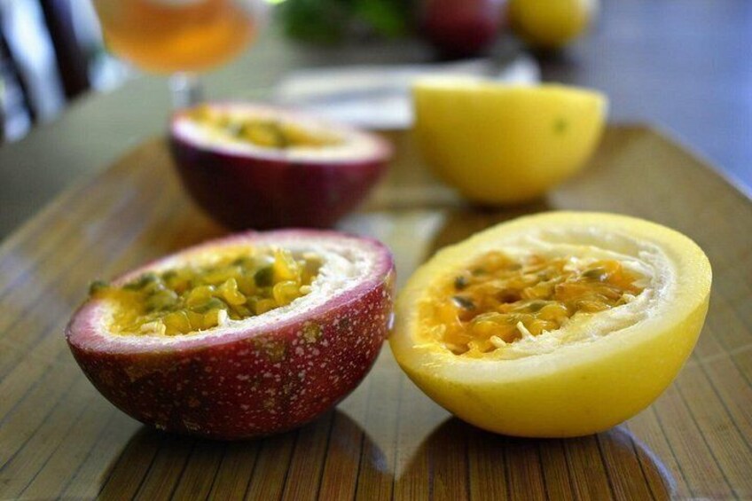 Passion fruit halves on a wooden surface. 5
