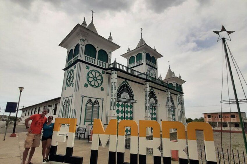 A church with a clock tower and a star-shaped light. 2