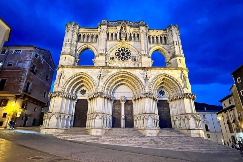 A historic cathedral with intricate architecture, including a large rose window and multiple arches. 2