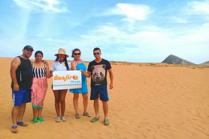 Happy adventurous travelers in Cabo de La Vela, near the Sugar Pylon. On each trip he makes new friends and increases union and happiness. 4