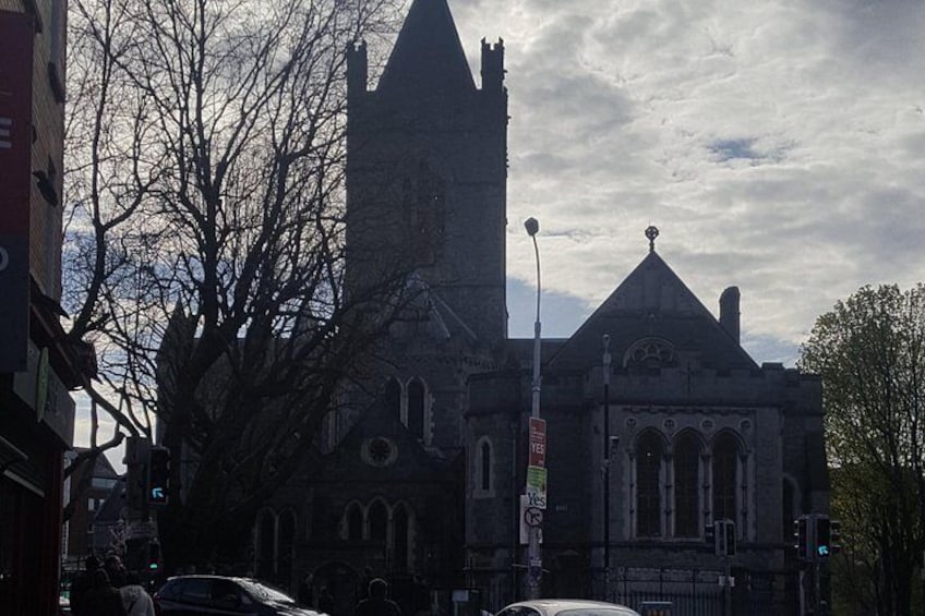 A historic church with a tall tower and arched windows. 1