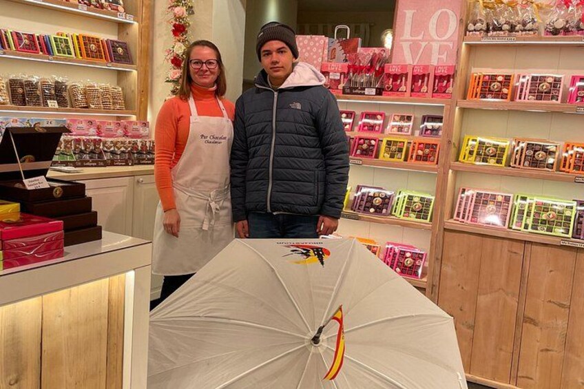 A store with shelves of greeting cards and an umbrella display. 3