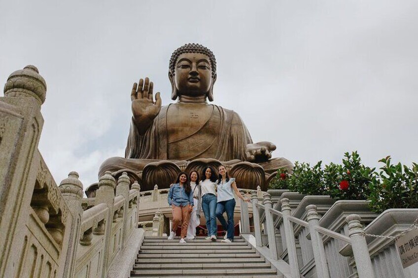 A large Buddha statue on a staircase. 1
