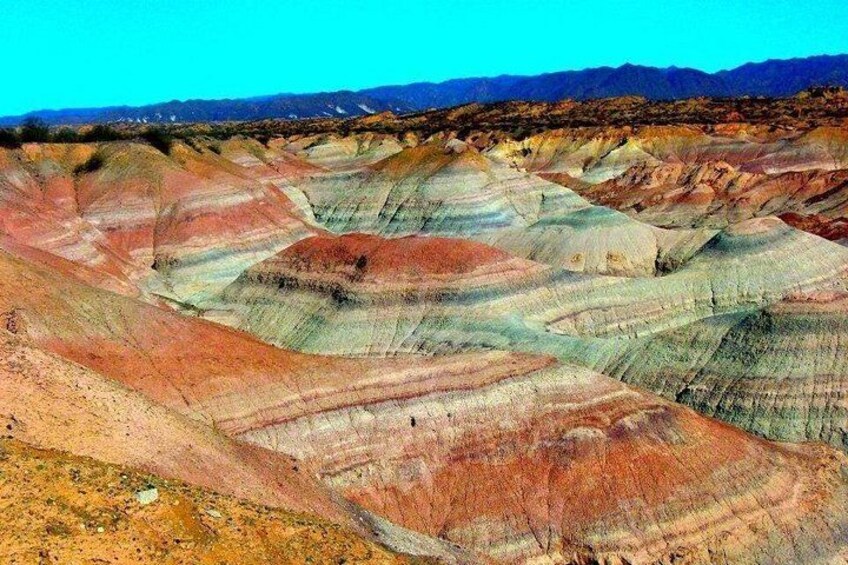 A colorful geological landscape with layered rock formations. 2