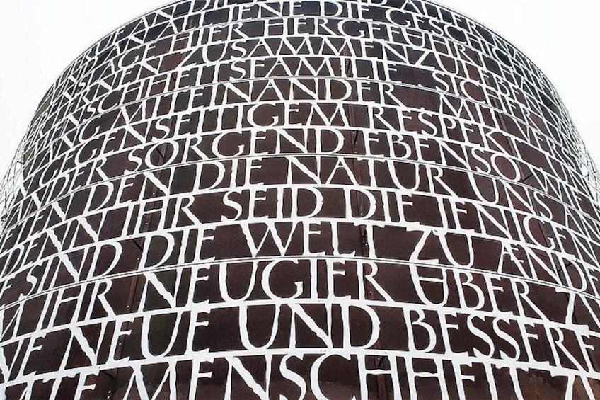 A spherical structure with text in multiple languages. 1