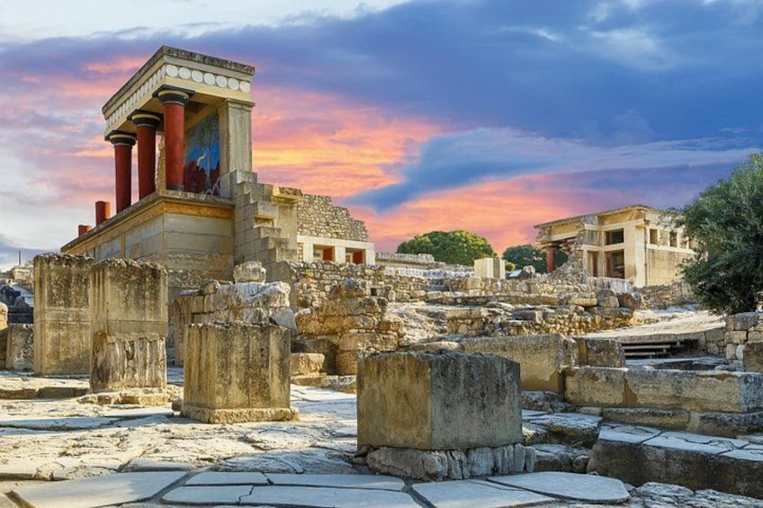 Ancient ruins with columns and a temple structure. 1