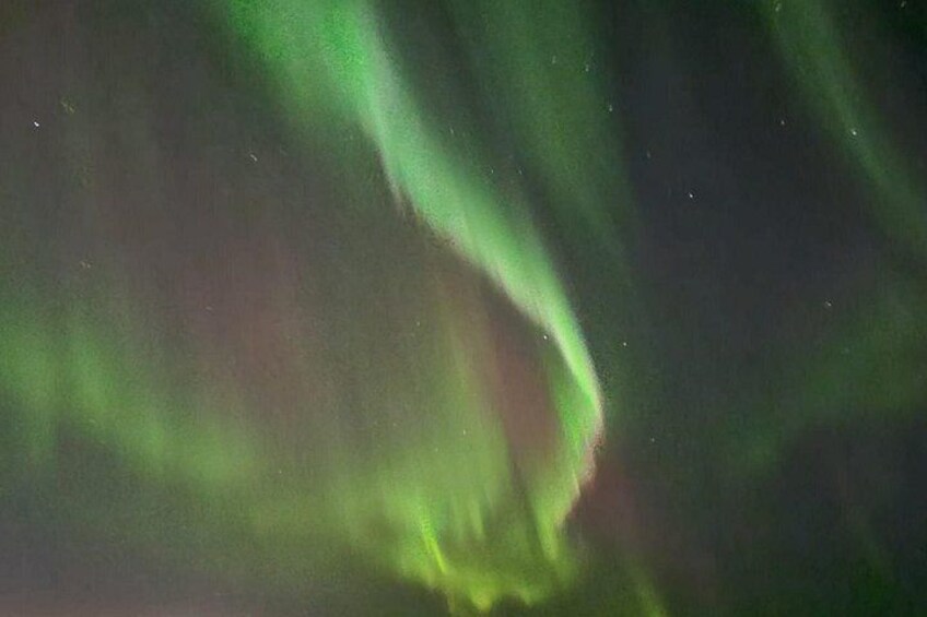 The aurora borealis with green and red hues. 4