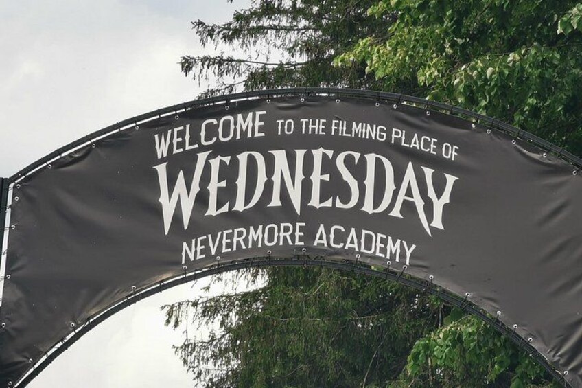 A sign welcoming visitors to the filming place of Wednesday Nevermore Academy. 5