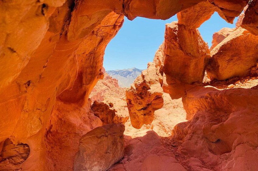 A rock formation with a natural archway. 2