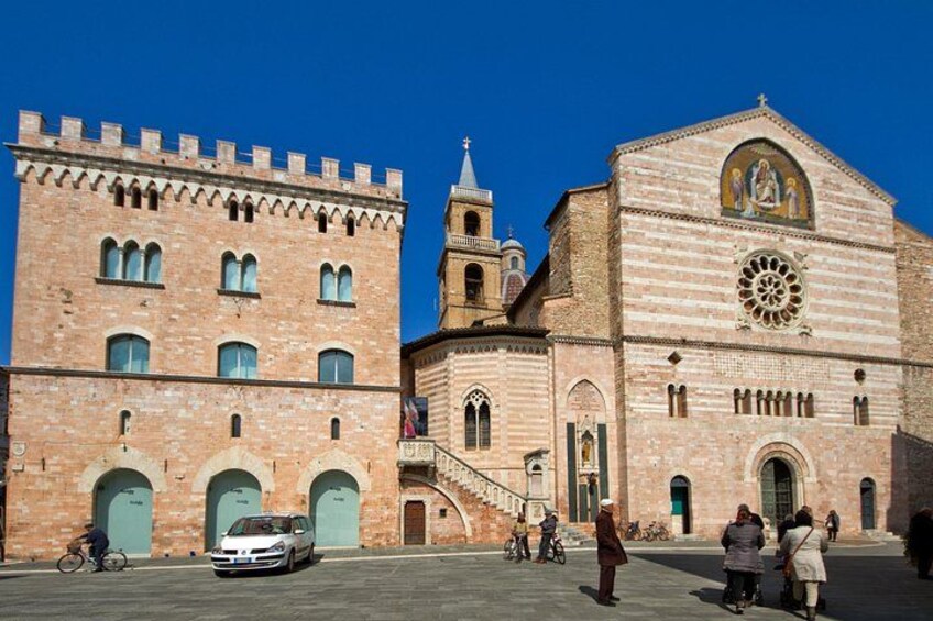 A historic building with arched windows and a bell tower. 1