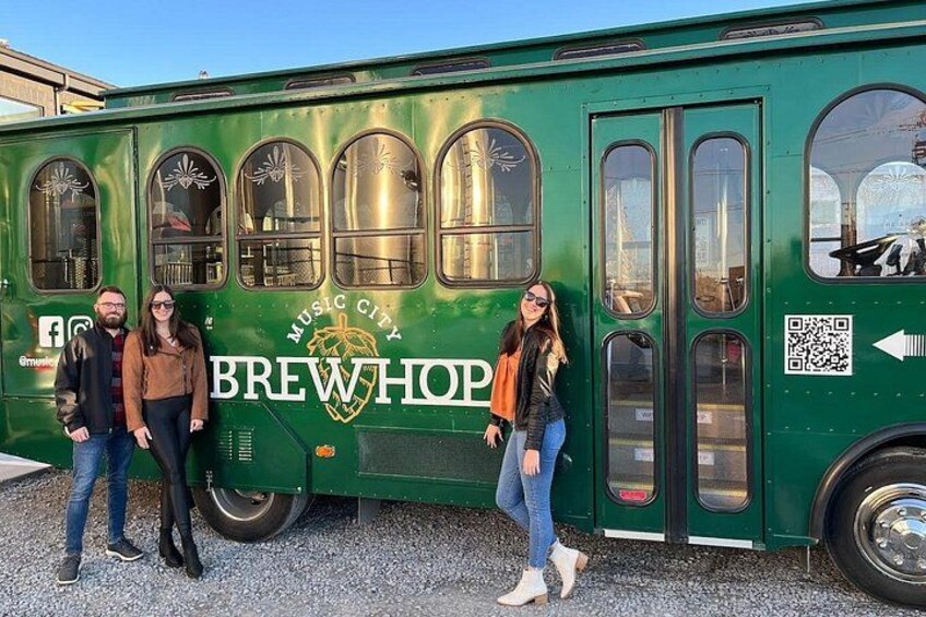 A green bus with 'BREWHOP' and 'MUSIC CITY' written on it. 4