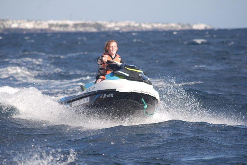 A person riding a jet ski on the water. 5