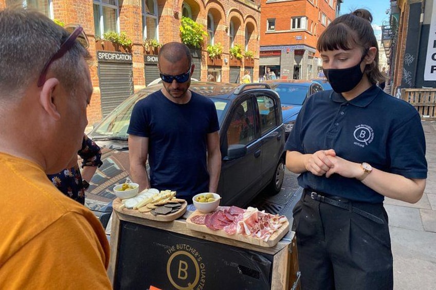 Charlotte talking us through our local cheese and meat platter. 2