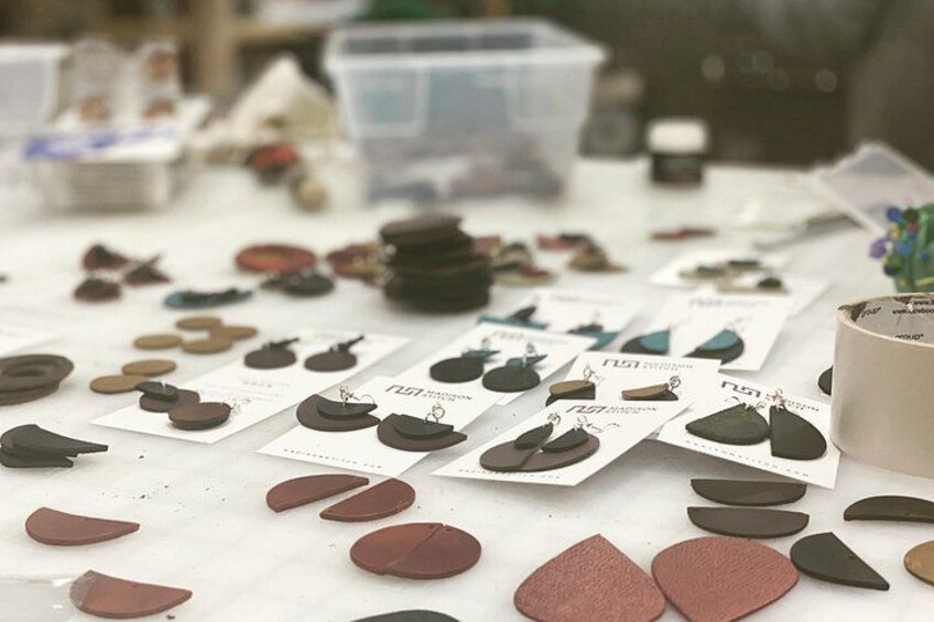 A table with various shoe designs and packaging. 2