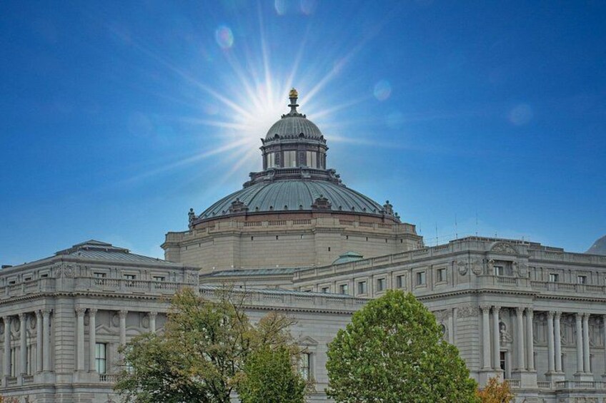 A large, historic building with a prominent dome and classical architecture. 2