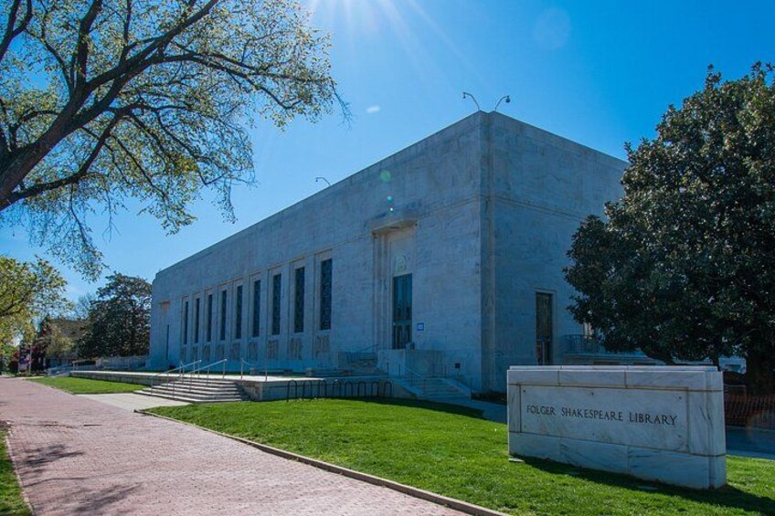 A large, modern building with a sign reading 'Folger Shakespeare Library.' 3