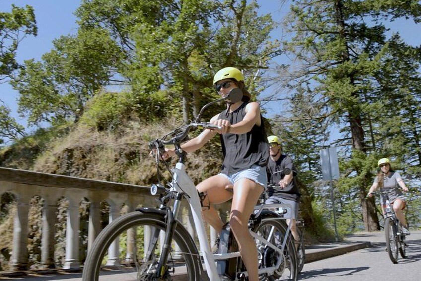 Ride your e-bikes effortlessly over dramatic bridges crossing huge waterfalls 1