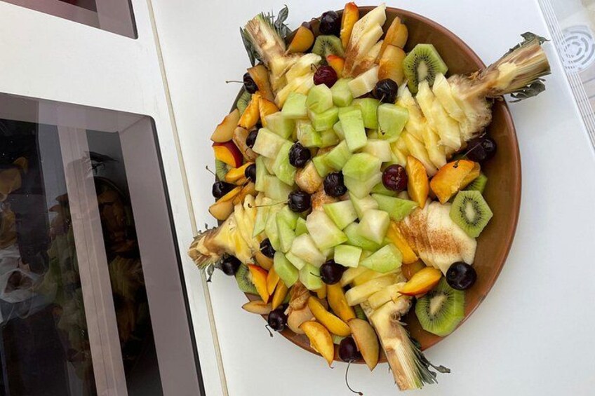 A fruit platter with various fruits and vegetables. 4