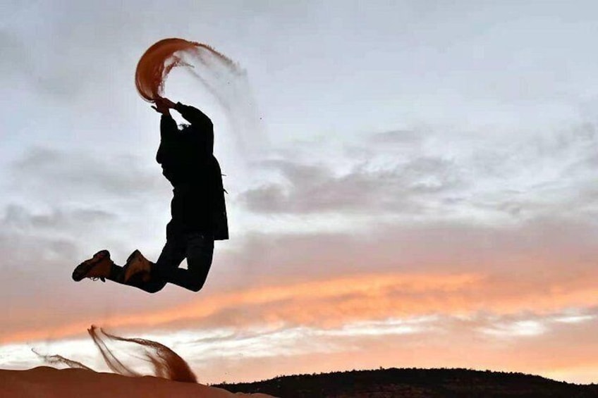 A person jumping with a parachute. 3