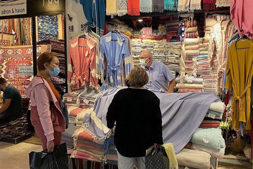 A fabric store with various textiles on display. 3