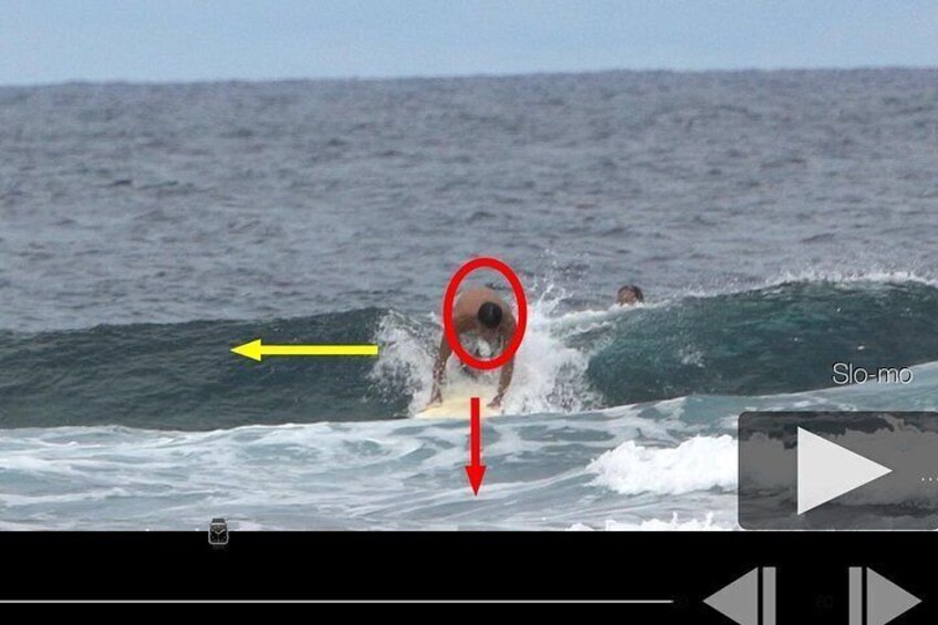 A surfer riding a wave in the ocean. 5