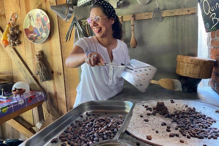 A person in a kitchen, stirring a mixture in a pot. 3