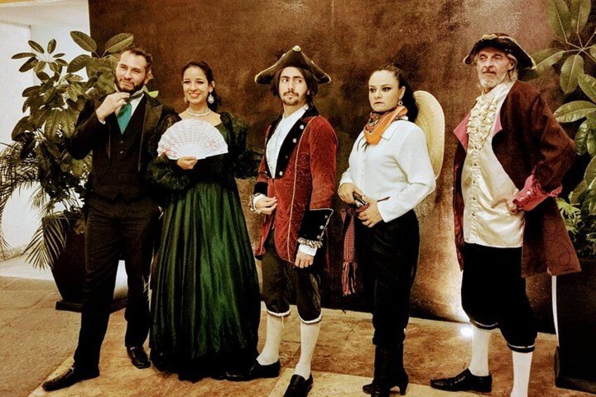 A group of people in historical costumes. 1