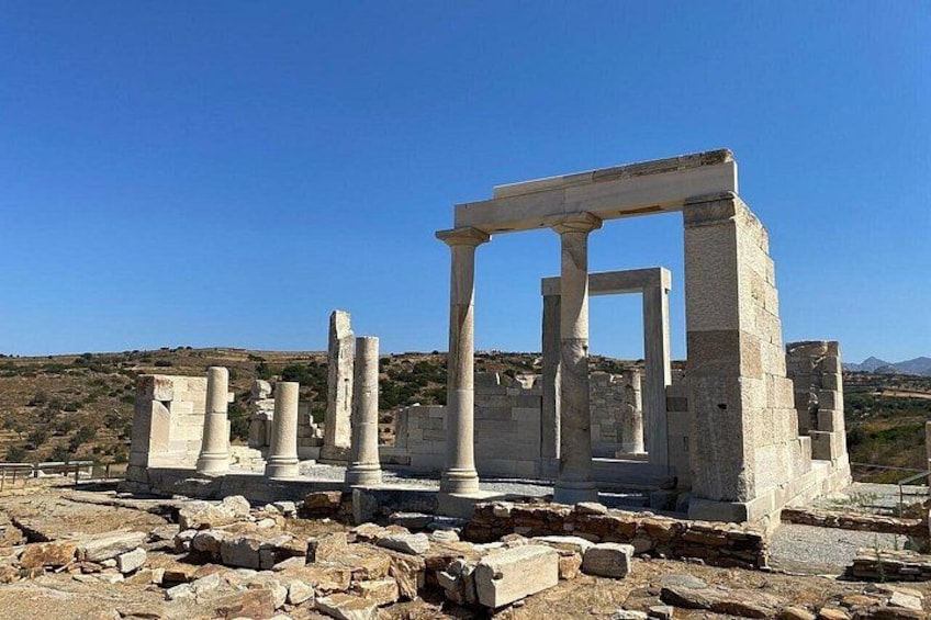 Ancient ruins with columns and stone structures. 2