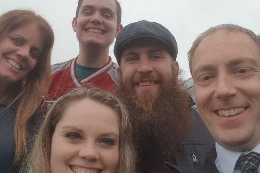 A group of people standing close together. 4