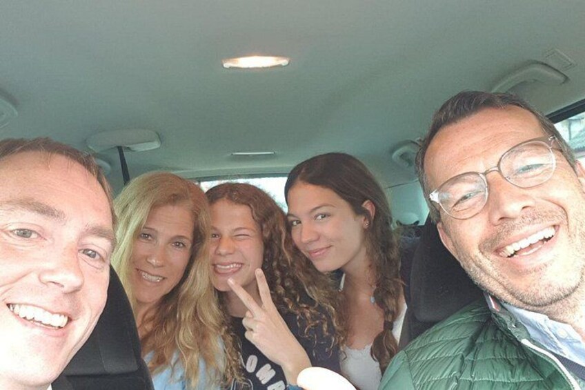 A group of people inside a vehicle. 5