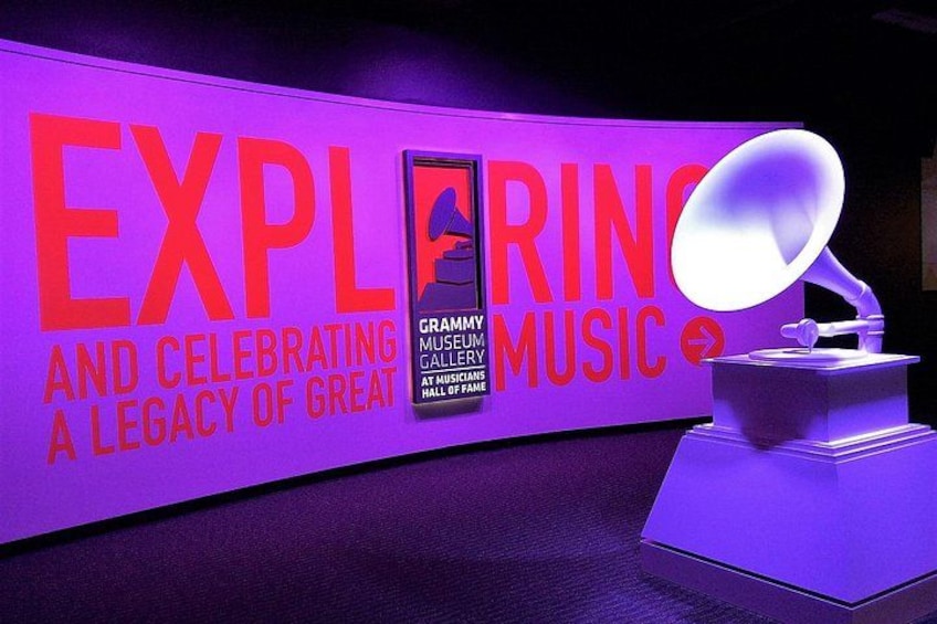 A purple wall with the text 'EXPLORING AND CELEBRATING A LEGACY OF GREAT MUSIC' and a Grammy Museum sign. 2