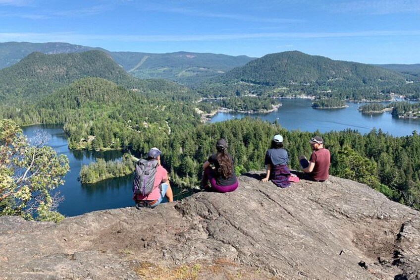 Four armigos are enjoying the stunning view of Pender Harbour. 1