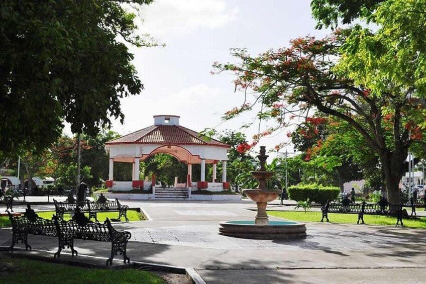 A gazebo, benches, a fountain, and a park with trees. 3