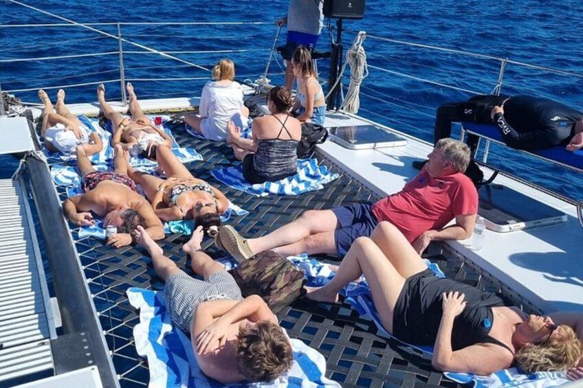 People sunbathing on a boat deck. 2
